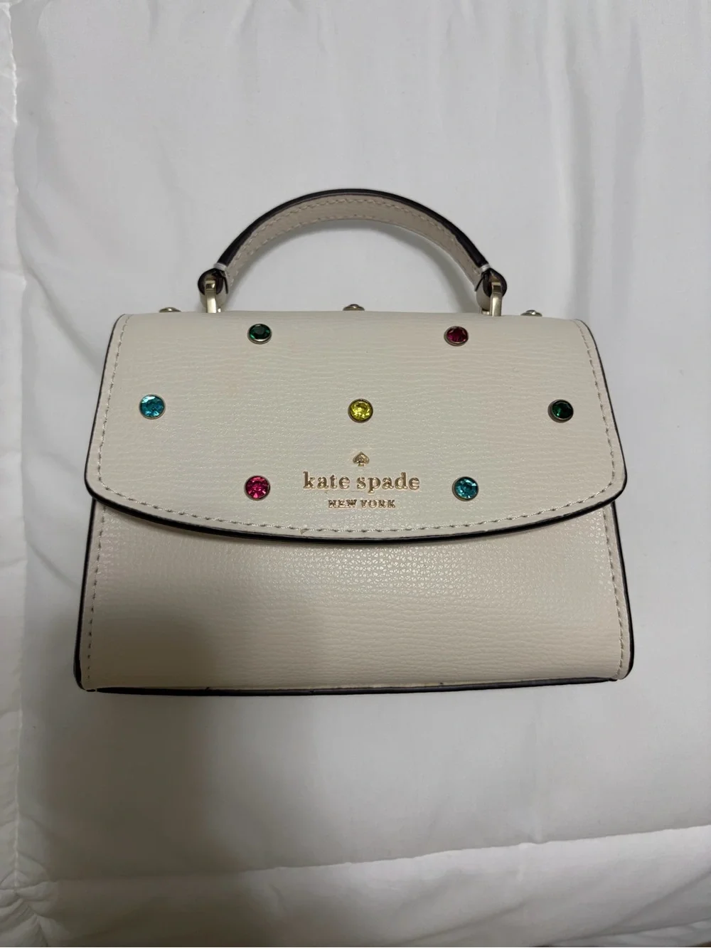 Limited edition kate spade cream mini top-handle bag with multicolor studs